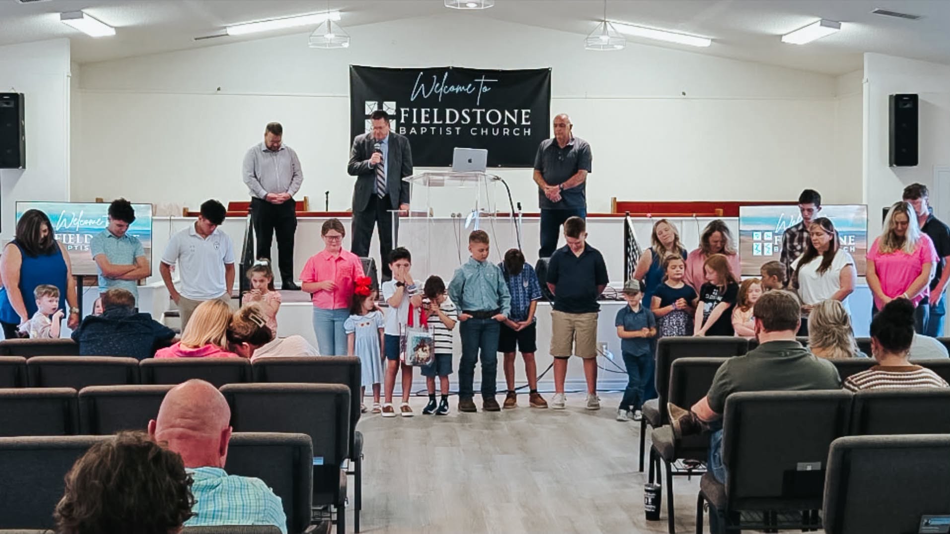Fieldstone church family praying together
